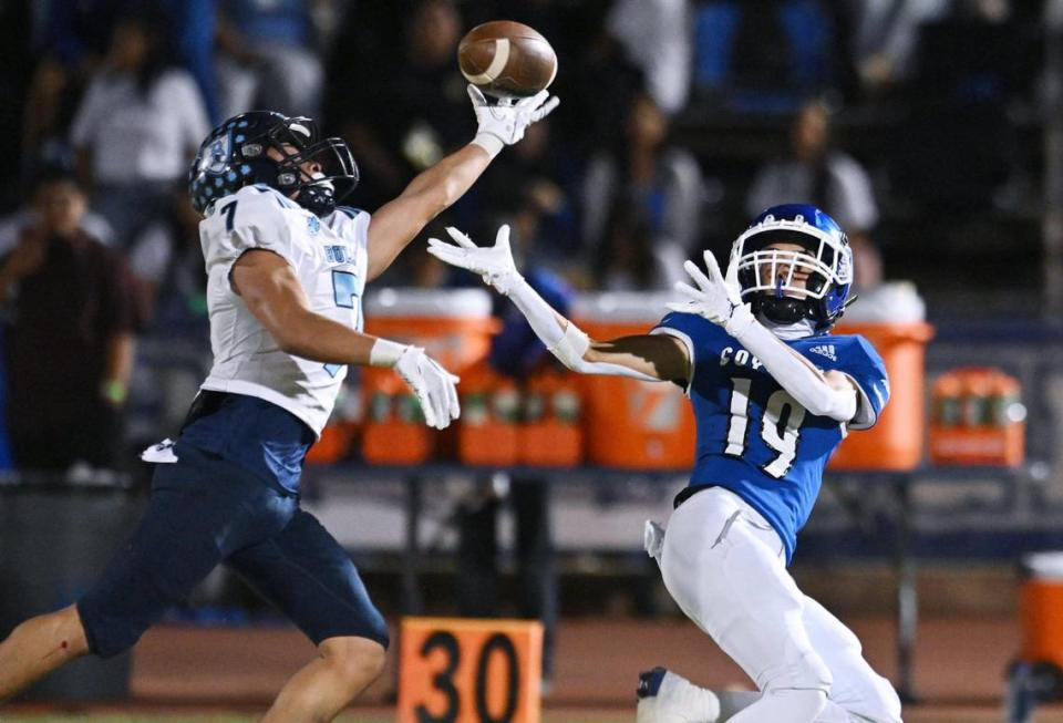 Bullard’s Dominick Gonzalez, left, tips a pass intended for Madera’s Kenji Tiscareno, right, in a CMAC game Friday, Sept. 29, 2023 in Madera. Madera led 6-0 at halftime, but Bullard rallied for the 7-6 win.