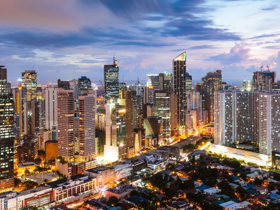 Makati skyline at dusk, Manila, Philippines - stock photo