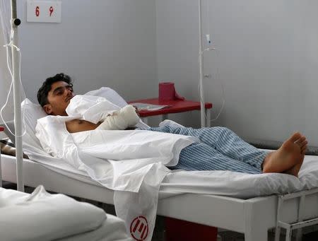 A wounded Afghan man, who survived last night's attack at American University of Afghanistan, receives treatment at the Emergency Hospital in Kabul, Afghanistan August 25, 2016. REUTERS/Omar Sobhani