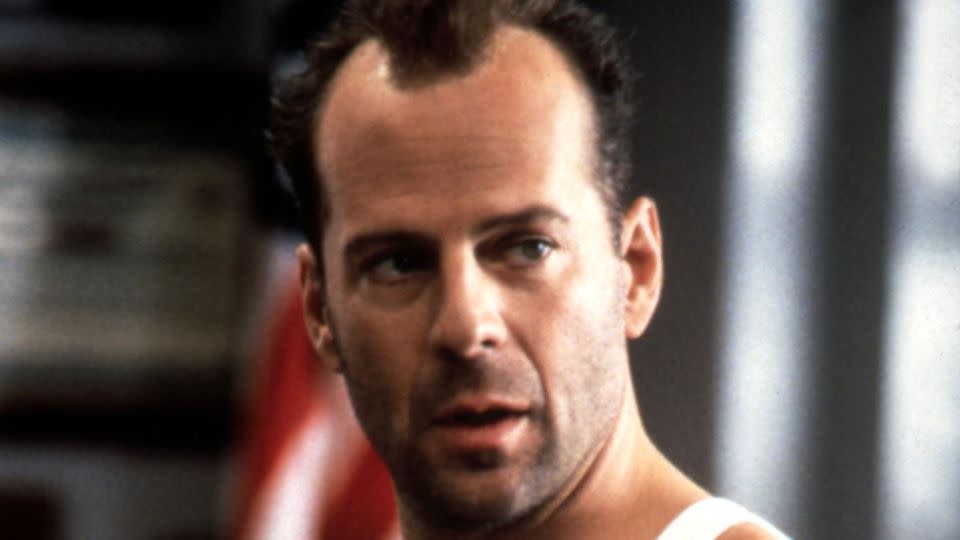 Bruce Willis as John McClane in the third film of the franchise, "Die Hard: With a Vengeance." - Moviestore/Shutterstock