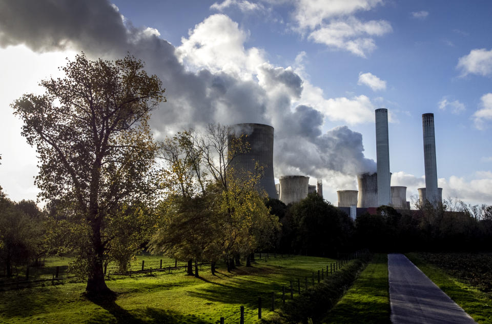 FILE - Steam rises from the coal-fired power plant Niederaussem, Germany, Wednesday, Nov. 2, 2022. A new accounting of carbon dioxide emissions finds that heat-trapping gas pollution from fossil fuels went up about 1% more than last year. (AP Photo/Michael Probst, File)