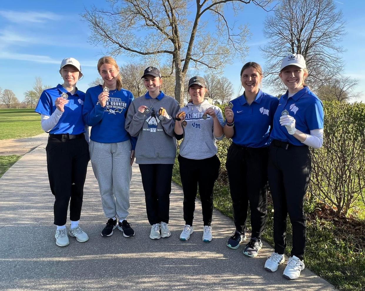 The Van Meter girls golf team poses for a photo after placing second during a tournament on Monday, April 17, 2023, at Lakeview Country Club in Winterset.
