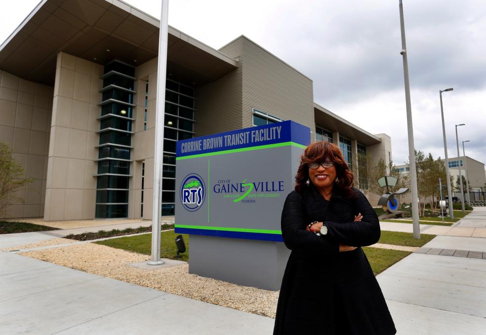Former U.S. Rep. Corrine Brown stands in front of the transit building in Gainesville named in her honor in November 2014.