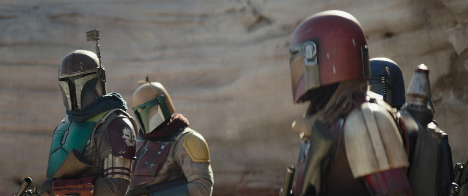 Mando meets a whole new bunch of Mandalorians in a scene from the Disney+ series, The Mandalorian. (Photo: Lucasfilm Ltd.)