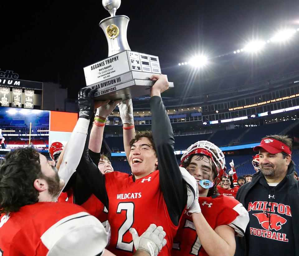 Quarterback captain Patrick Miller hoists the winning trophy.

Milton High wins the MIAA Division 3 State Championship beating Walpole at Gillette Stadium on Thursday Nov. 30, 2023