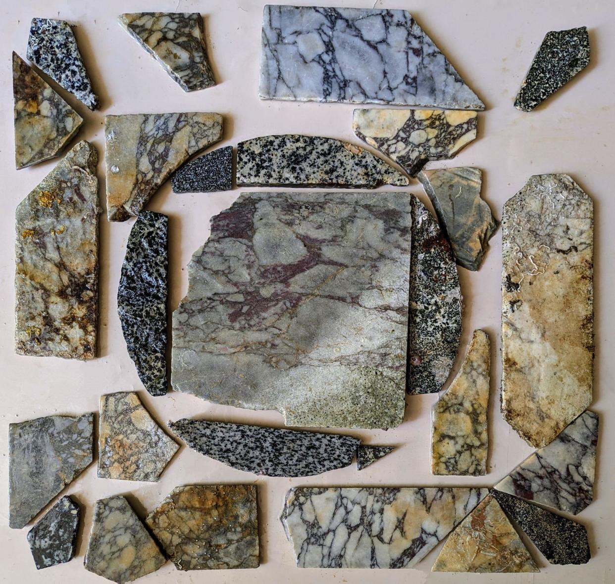 Researchers work to rearrange the mosaic tiles after bringing them up from underwater.  / Credit: Parco Archeologico Campi Flegrei