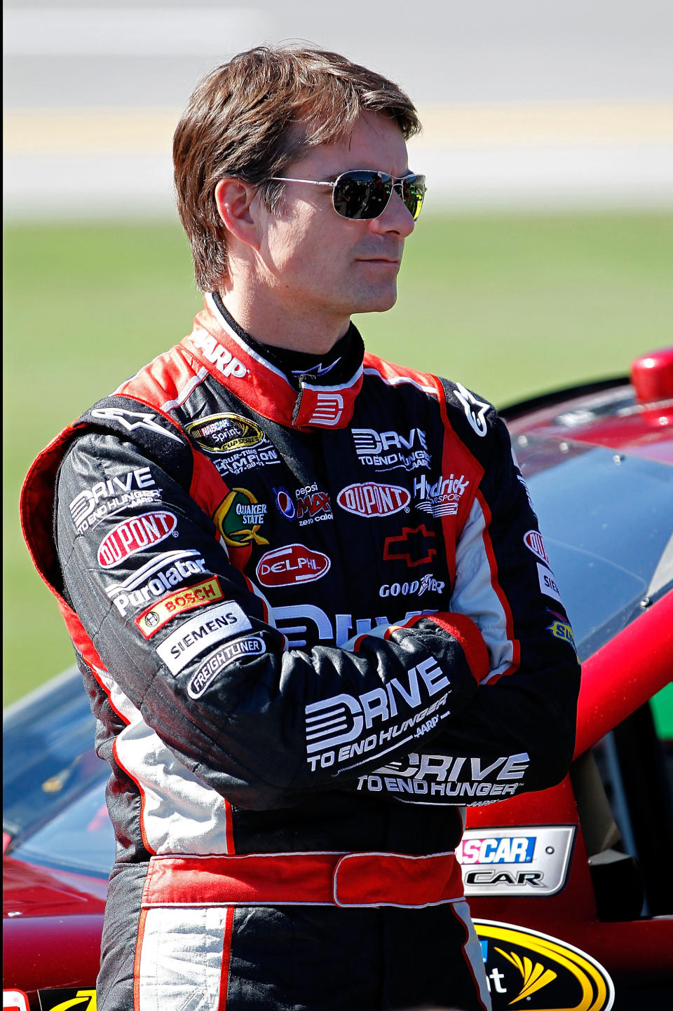 TALLADEGA, AL - OCTOBER 22: Jeff Gordon, driver of the #24 Drive to End Hunger Chevrolet, looks on during qualifying for the NASCAR Sprint Cup Series Good Sam Club 500 at Talladega Superspeedway on October 22, 2011 in Talladega, Alabama. (Photo by Geoff Burke/Getty Images for NASCAR)