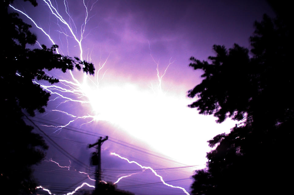 Lighting flashes Saturday morning, June, 30, 2012 in Hebron Md.. Violent storms swept across the eastern U.S., killing at least nine people and knocking out power to hundreds of thousands on a day that temperatures across the region are expected to reach triple-digits. (AP photo by Salisbury Daily Times, Kristin Roberts)