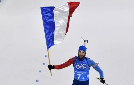 Biathlon - Pyeongchang 2018 Winter Olympics - Mixed Relay Final - Alpensia Biathlon Centre - Pyeongchang, South Korea - February 20, 2018 - Martin Fourcade of France celebrates. REUTERS/Toby Melville