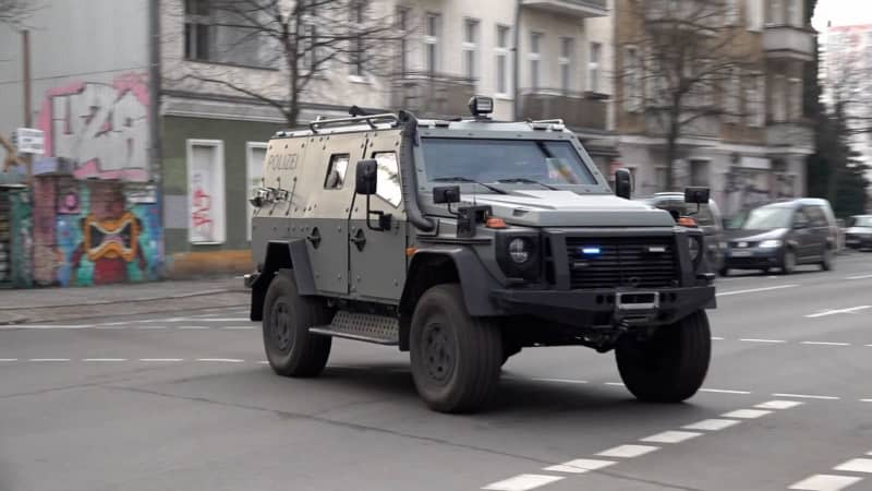 An armoured vehicle is parked on the street during an operation connected with the manhunt for the two suspected robbers Ernst-Volker Staub and Burkhard Garweg, who are still on the run. Paul Zinken/dpa
