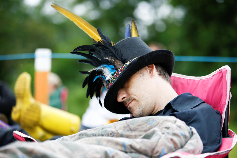 A man sleeps in a queue for Glastonbury Festival at Worthy farm in Somerset, Britain June 26, 2019. REUTERS/Henry Nicholls