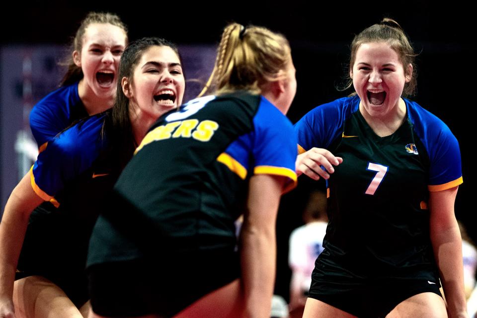 Howards Grove's Eden Maranell (5), Jackie Yancy (8), Elle Schueler (7) celebrates Saige Damrow (3) during the first set of the WIAA Division 3 state semifinal against Wittenberg-Birnamwood on Nov. 4, 2022, at the Resch Center in Green Bay.