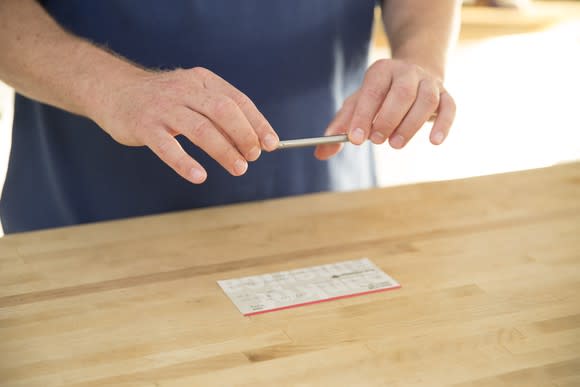 A person using Bank of America's mobile app to deposit a check.