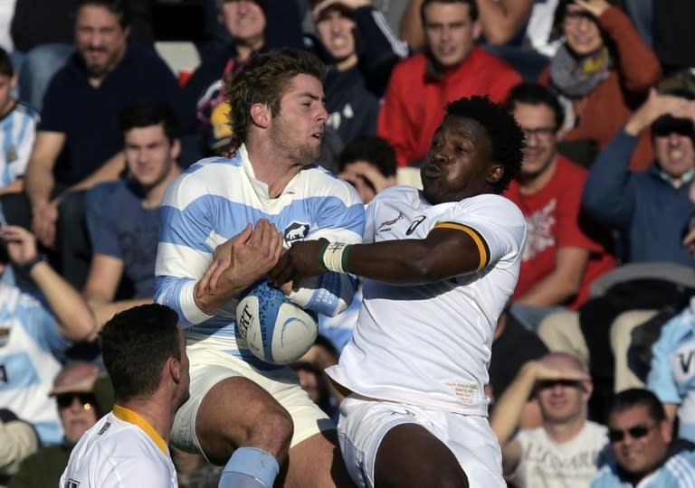 South Africa wing Lwazi Mvovo (R) tackles Argentina counterpart Santiago Cordero during their 2015 Rugby World Cup warm-up match at Jose Amalfitani stadium in Buenos Aires on August 15, 2015