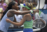 Sofia Kenin, right, of the U.S. is embraced by compatriot Coco Gauff after winning their fourth round singles match at the Australian Open tennis championship in Melbourne, Australia, Sunday, Jan. 26, 2020. (AP Photo/Andy Brownbill)