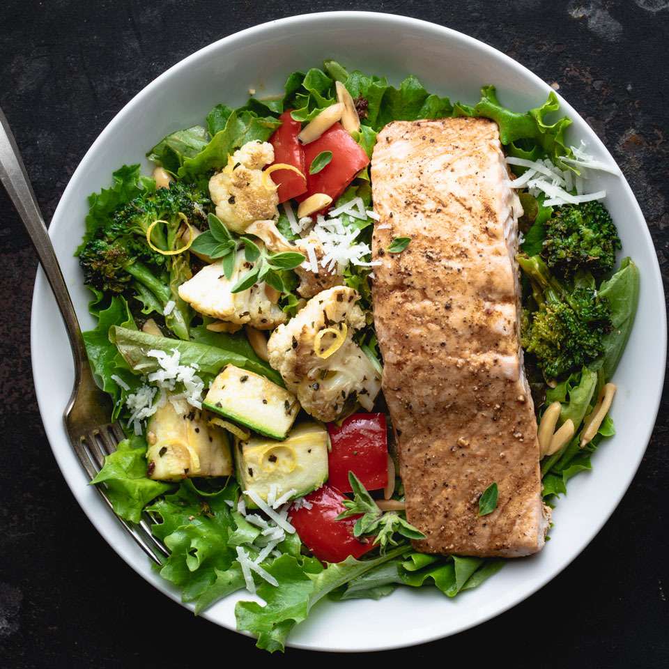 <p>If mixed salads fail to fill you up, try this hearty Greek salmon salad recipe, which calls for bulking up a traditional bed of mixed greens with roasted vegetables and protein-rich salmon. Leftovers make it a breeze to put together this delicious Mediterranean salad. Here we suggest two recipes you could meal-prep ahead of time--Lemon-Roasted Mixed Vegetables and Sweet & Spicy Roasted Salmon--but you can use whatever roasted veggies you have on hand and pick up a precooked salmon fillet from the deli counter at your grocery store. This healthy salad would also be good with chicken. Serve it for an easy dinner or pack it up for lunch.</p>