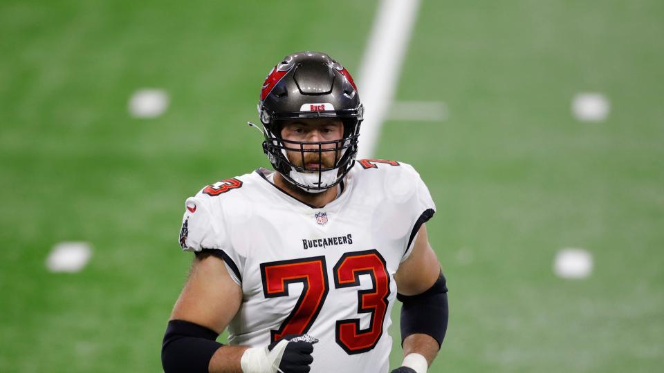 Tampa Bay Buccaneers offensive tackle Joe Haeg runs to the bench during the first half of an NFL football game, Saturday, Dec. 26, 2020, in Detroit.