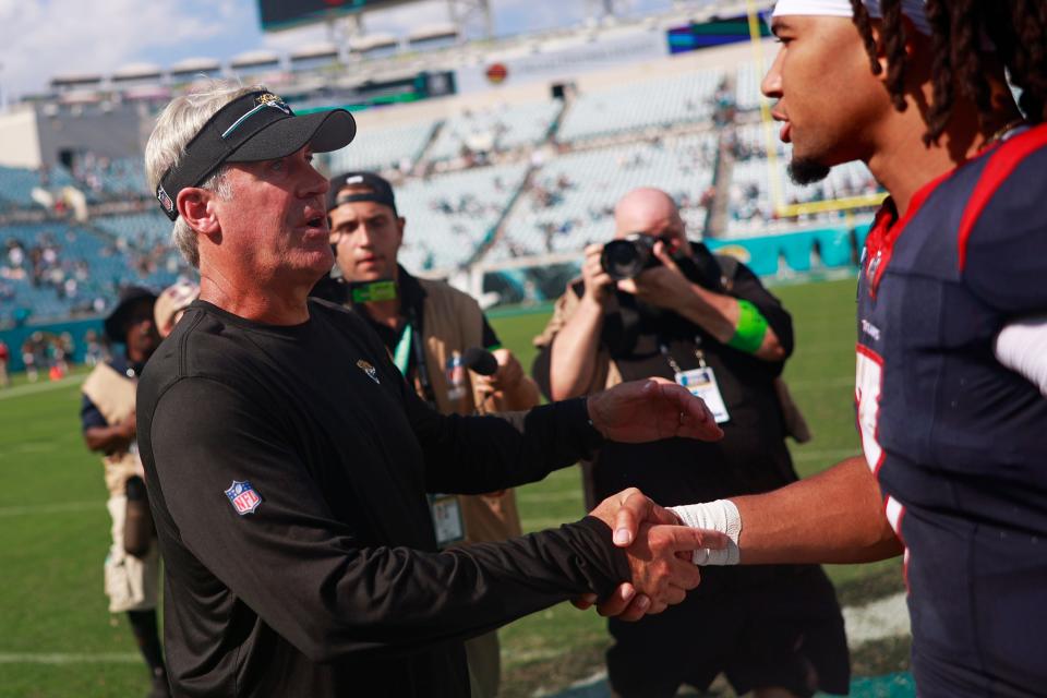Jacksonville Jaguars head coach Doug Pederson congratulates Houston Texans quarterback C.J. Stroud (7) for his performance after the game of an NFL football matchup Sunday, Sept. 24, 2023 at EverBank Stadium in Jacksonville, Fla. The Houston Texans defeated the Jacksonville Jaguars 37-17. [Corey Perrine/Florida Times-Union]