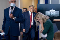 President Donald Trump returns to a news conference in the James Brady Press Briefing Room after he briefly left because of a security incident outside the fence of the White House, Monday, Aug. 10, 2020, in Washington. (AP Photo/Andrew Harnik)