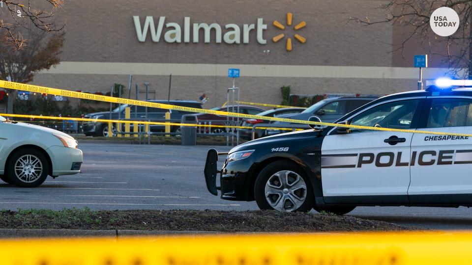 Law enforcement work the scene of a mass shooting at a Walmart, Wednesday, Nov. 23, 2022, in Chesapeake, Va. The store was busy just before the shooting Tuesday night with people stocking up ahead of the Thanksgiving holiday. (AP Photo/Alex Brandon)