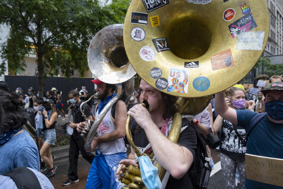 Demonstrators move along W. 34th Street Saturday, June 6, 2020, in New York. Protests continued following the death of George Floyd, who died after being restrained by Minneapolis police officers on May 25. (AP Photo/Craig Ruttle)