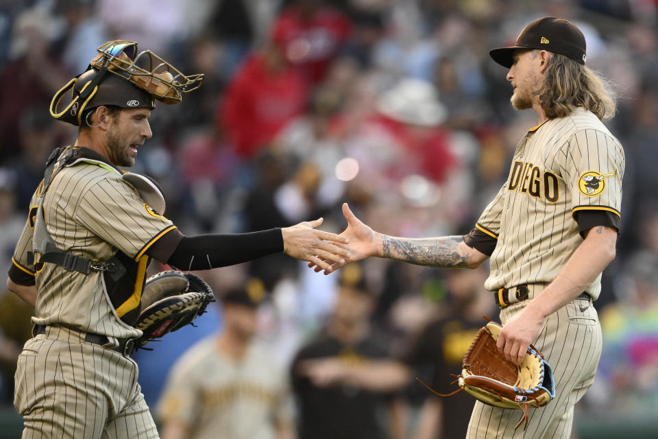 San Diego Padres relief pitcher Josh Hader, right, and catcher Austin Nola celebrate the team's 8-6 win in a baseball game against the Washington Nationals, Thursday, May 25, 2023, in Washington. (AP Photo/Nick Wass)