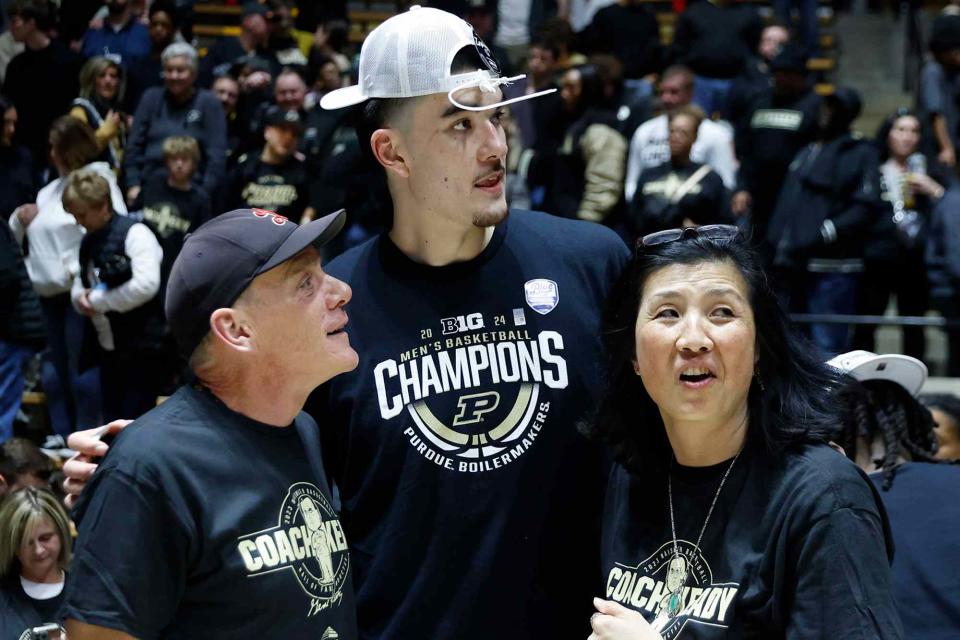 <p>Brian Spurlock/Icon Sportswire/Getty </p> Zach Edey with his parents after defeating the Michigan State Spartans and winning the Big Ten Championship on March 2, 2024.