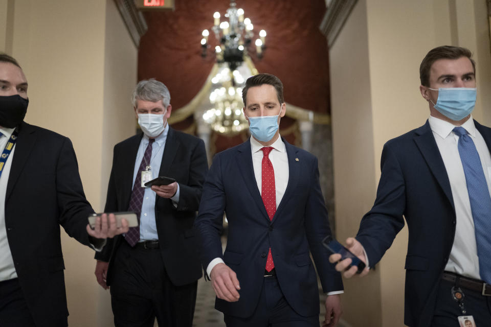 FILE - In this Jan. 6, 2021, file photo after violent protesters loyal to President Donald Trump stormed the U.S. Capitol today, Sen. Josh Hawley, R-Mo., walks to the House chamber to challenge the results of the presidential election in Pennsylvania during the joint session of the House and Senate to count the Electoral College votes cast in November's election, at the Capitol in Washington. (AP Photo/J. Scott Applewhite, File)