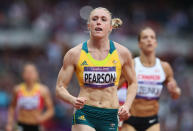 Sally Pearson of Australia leads Jessica Zelinka of Canada in the Women's 100m Hurdles Semifinals on Day 11 of the London 2012 Olympic Games at Olympic Stadium on August 7, 2012 in London, England. (Photo by Streeter Lecka/Getty Images)