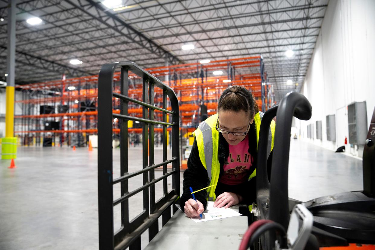 Cassie Reinecke marks up a checklist during a Freestore Foodbank class that provides skills to workers, with a goal of helping them earn a living wage in distribution and logistics employment.