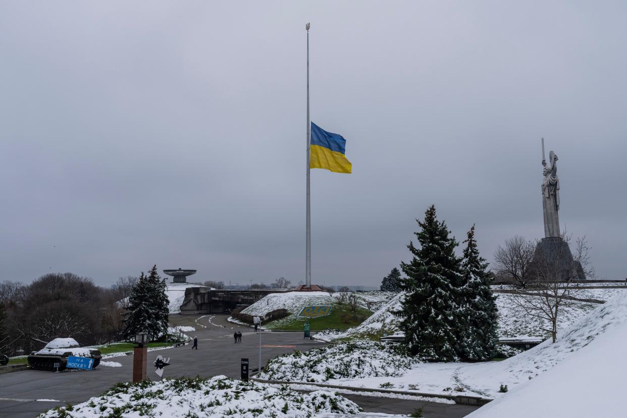 The Ukrainian flag flutters at half mast near the Ukrainian Motherland monument in Kyiv, Ukraine, on Nov. 29, 2022.