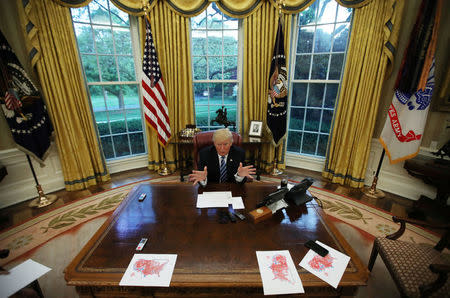 FILE PHOTO: U.S. President Donald Trump speaks during an interview with Reuters in the Oval Office of the White House in Washington, U.S., April 27, 2017. REUTERS/Carlos Barria/File Photo
