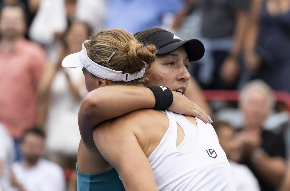 Jessica Pegula, of the United States, left, hugs Liudmila Samsonova of Russia, following Pegula's win at the National Bank Open women's tennis tournament in Montreal, Sunday, Aug.13, 2023. (Christinne Muschi/The Canadian Press via AP)