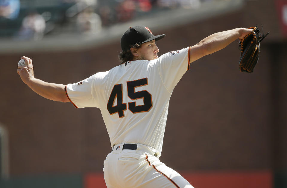 San Francisco Giants starting pitcher Derek Holland works in the first inning of a baseball game against the Atlanta Braves Wednesday, Sept. 12, 2018, in San Francisco. (AP Photo/Eric Risberg)