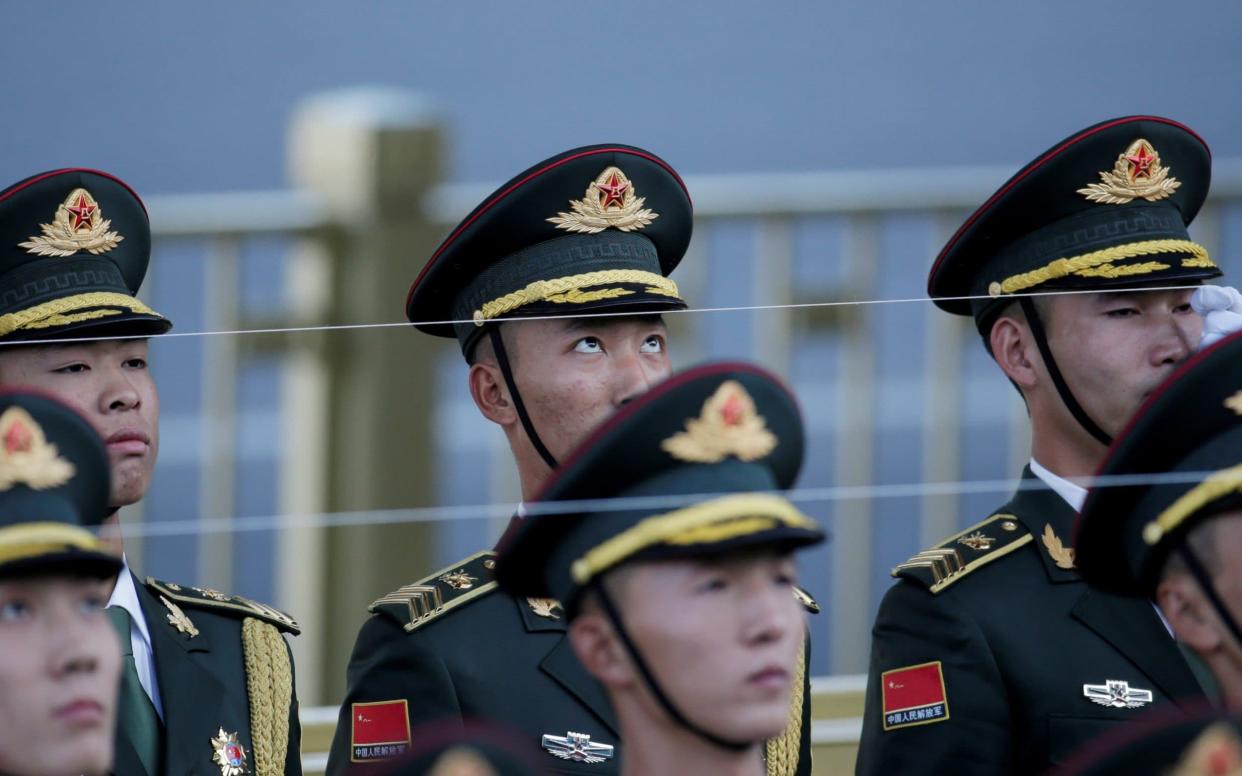 Members of the honour guard attend a welcome ceremony in Beijing - REUTERS