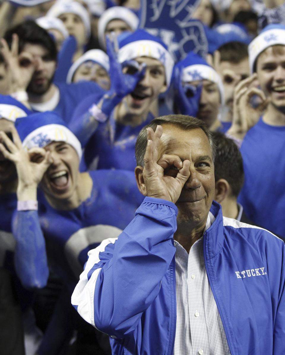 FILE - House Speaker John Boehner of Ohio makes the three-point goggles gesture before an NCAA college basketball game between Kentucky and North Carolina in Lexington, Ky., Saturday, Dec. 3, 2011. (AP Photo/James Crisp, File)