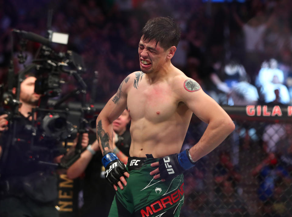 Jun 12, 2021; Glendale, Arizona, USA; Brandon Moreno celebrates his championship victory against Deiveson Figueiredo during UFC 263 at Gila River Arena. Mandatory Credit: Mark J. Rebilas-USA TODAY Sports