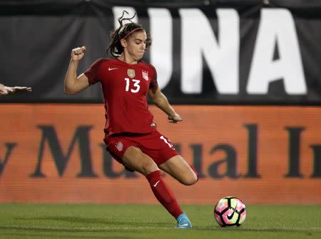 Apr 6, 2017; Frisco, TX, USA; USA forward Alex Morgan (13) controls the ball against Russia at Toyota Stadium. Mandatory Credit: Matthew Emmons-USA TODAY Sports