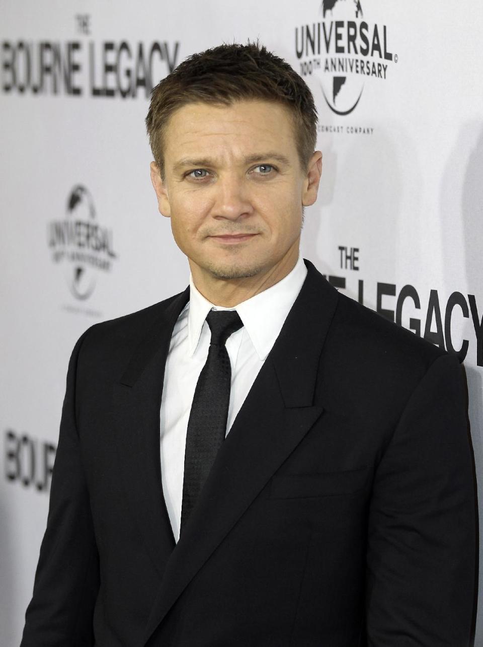 FILE - This Aug. 7, 2012 file photo shows actor Jeremy Renner on the red carpet for the premier of "The Bourne Legacy" in Sydney, Australia. Renner, Julia Roberts, Matt Damon, Samuel L. Jackson and Emma Stone are among the stars participating in the third Stand Up to Cancer telethon, the organization announced Wednesday, Aug. 22. (AP Photo/Rob Griffith, file)