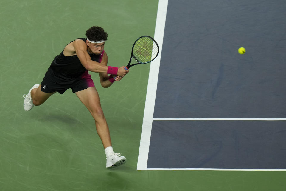 Ben Shelton of the United States returns a shot to his compatriot Sebastian Korda during the men's singles quarterfinal match in the Shanghai Masters tennis tournament at Qizhong Forest Sports City Tennis Center in Shanghai, China, Thursday, Oct. 12, 2023. (AP Photo/Andy Wong)