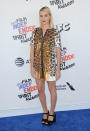 <p>The<em> I, Tonya</em> star struck a pose in a leopard-print minidress and black strappy sandals. She kept her beauty minimal, with sleek locks and a pop of burgundy on her lips. (Photo: Getty Images) </p>
