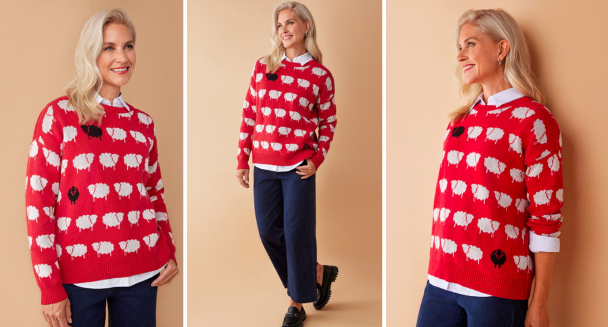 Northern reflections model wears red sweater with black and white sheep print inspired by princess diana