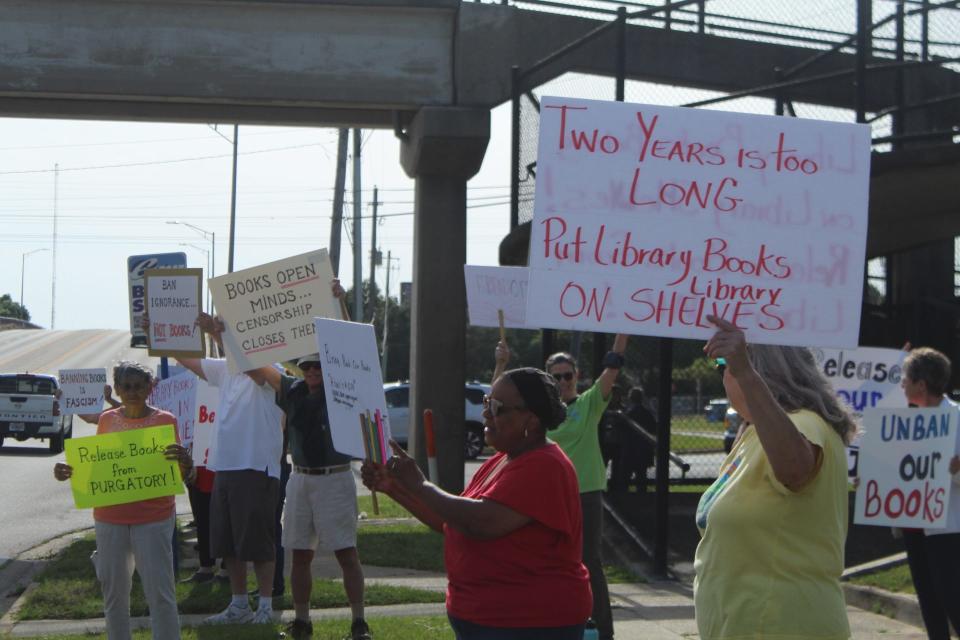 A "Bring Back Our Books Rally" formed outside of Pensacola's J.E. Hall Center Tuesday prior to the Escambia County School Board meeting in support of returning challenged school library books to the shelves.