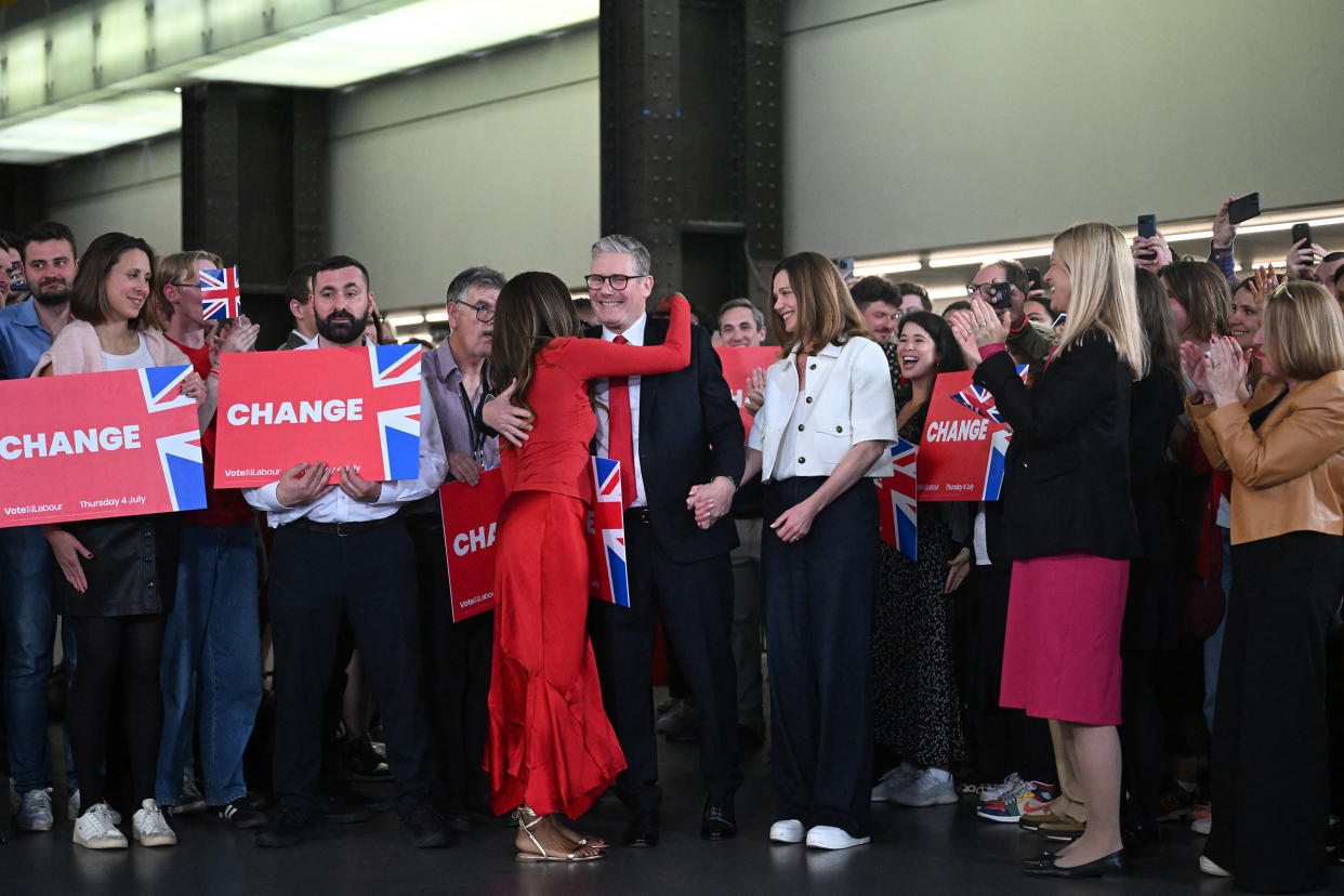 Starmer, center, is hugged as he arrives with his wife Victoria to deliver a speech at the Tate Modern in London early on July 5, 2024. <span class="copyright">Justin Tallis—AFP/Getty Images</span>