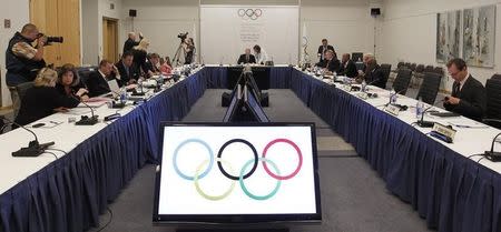 Members of the IOC talk prior to the beginning of the IOC executive board meeting at the SportAccord convention at the Congress Center in Quebec City, May 24, 2012. REUTERS/Mathieu Belanger