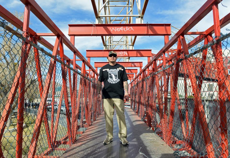 Ivan Ocon stands on a passenger bridge in Ciudad Juárez in 2019, where lived since being deported in 2016.