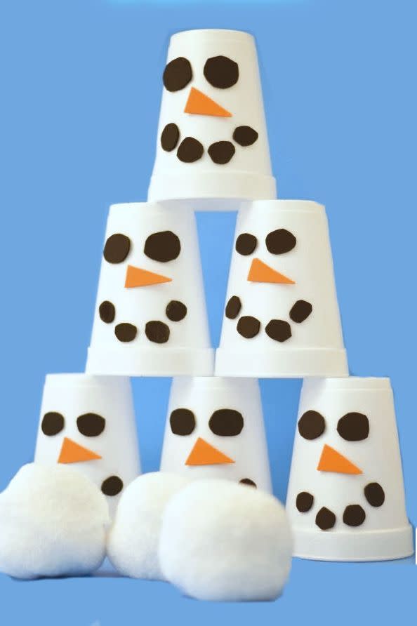 <p>This quieter, softer tabletop version of snowman bowling will keep the kids occupied while the grown-ups get dinner ready. Decorate white Styrofoam cups with adorable felt <a href="https://www.goodhousekeeping.com/holidays/christmas-ideas/a42045/snowman-dollar-store-candles/" rel="nofollow noopener" target="_blank" data-ylk="slk:snowmen faces;elm:context_link;itc:0;sec:content-canvas" class="link ">snowmen faces</a>, pile them into a pyramid, and toss a pom-pom "snowball" at them to see who can get a strike. </p><p><em><a href="http://www.growingajeweledrose.com/2013/12/snowman-slam-game-for-kids.html" rel="nofollow noopener" target="_blank" data-ylk="slk:Get the tutorial at Growing a Jeweled Rose »;elm:context_link;itc:0;sec:content-canvas" class="link ">Get the tutorial at Growing a Jeweled Rose »</a></em><br></p>