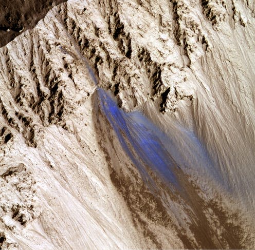 <span class="caption">Mars landslide. The blue area represents the landslide debris.</span>