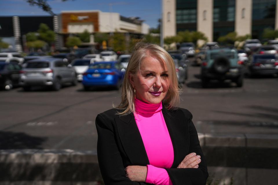 Tess Loo, a Siner sister and a 2% shareholder of My Sister's Closet, poses for a portrait on East Camelback Road on March 29, 2023, in Phoenix.