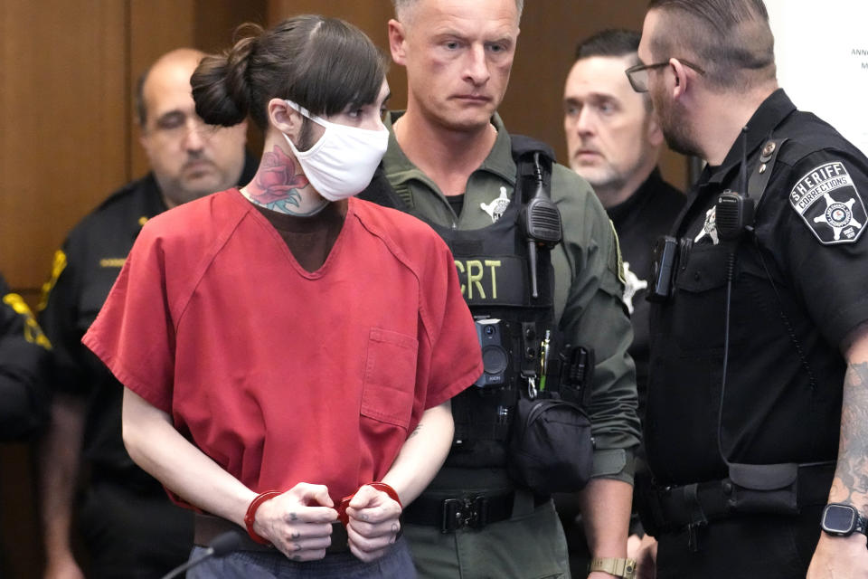 Robert E. Crimo III, left, looks at his father Robert E. Crimo Jr., and his mother Denise Pesina as he is escorted into a courtroom during a case management conference before Judge Victoria A. Rossetti at the Lake County Courthouse Friday, Jan. 5, 2024, in Waukegan, Ill. A case management conference is scheduled for a suspect in a mass shooting that left seven people dead during a July 4 parade in Highland Park, Illinois. (AP Photo/Nam Y. Huh, Pool)